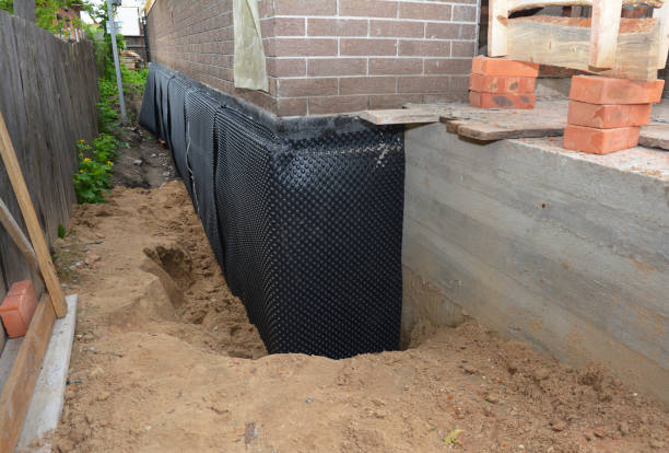 Happy homeowners after waterproofing job in Onward